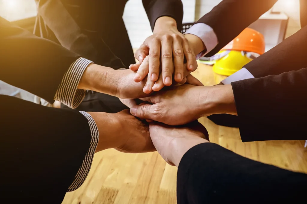 Business Group of People Joining Hands Together